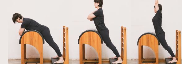 mulher realizando exercício para melhorar pilates no avc de preparação para swan na maquina ladder barrell do pilates